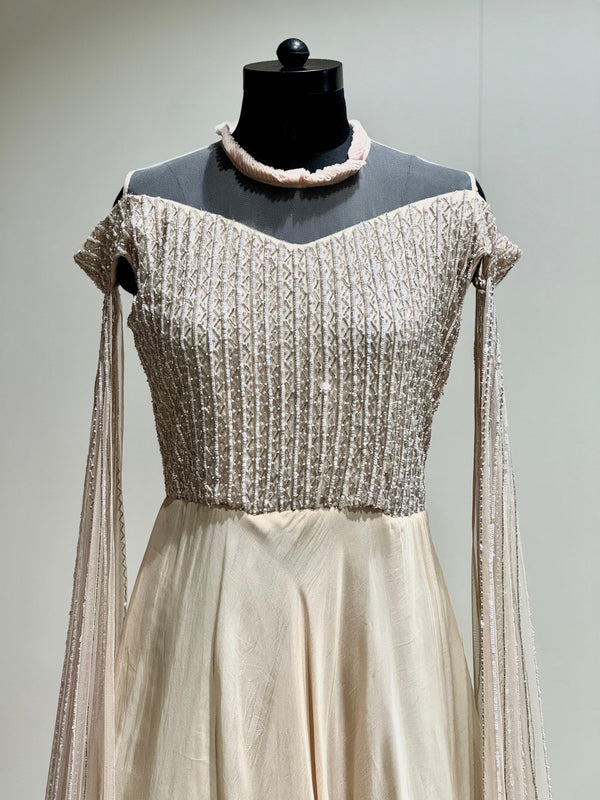 Beige tail sleeves gown
