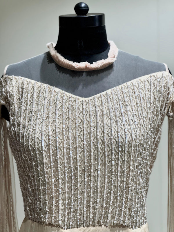 Beige tail sleeves gown