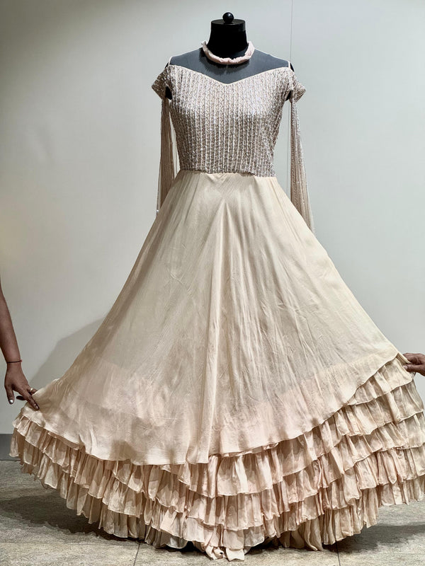 Beige tail sleeves gown